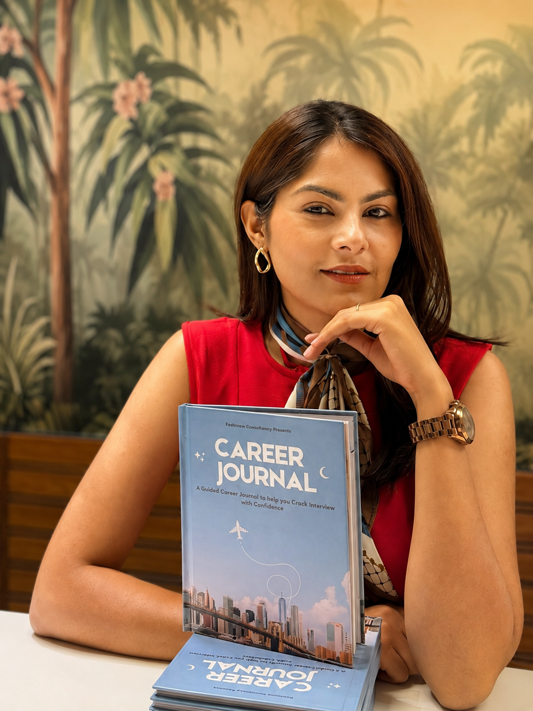 Kanika Gandhi holding The Career Journal